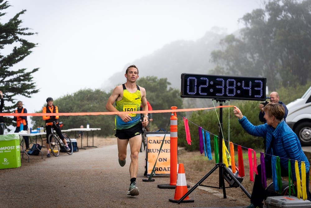 CJ Albertson reaches the finish line for a new 50K world record