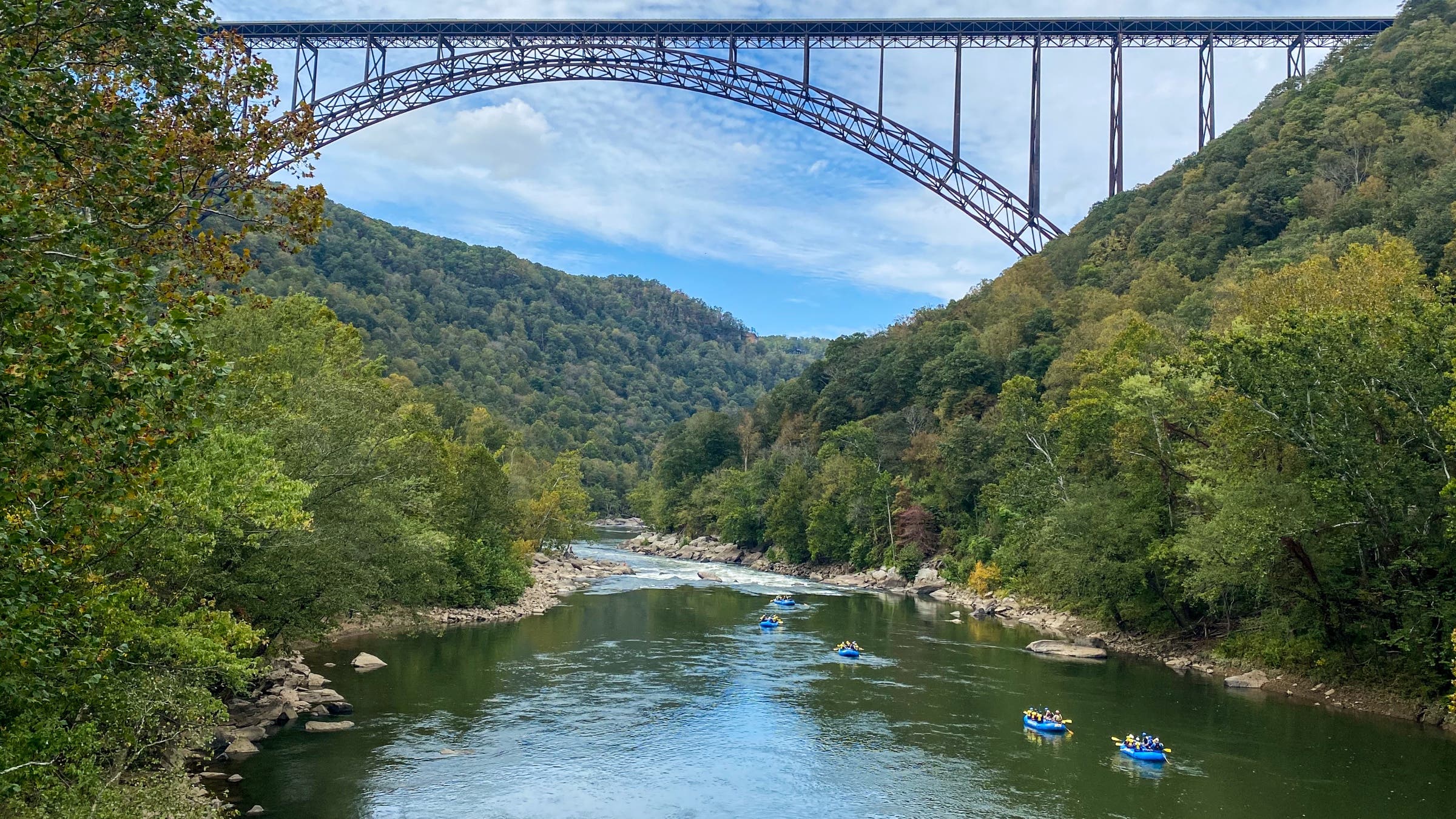 Rafting boats make their way down a tamer section of the New River.