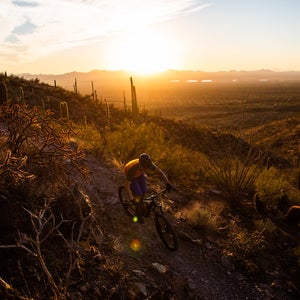 mountain biking at sunset