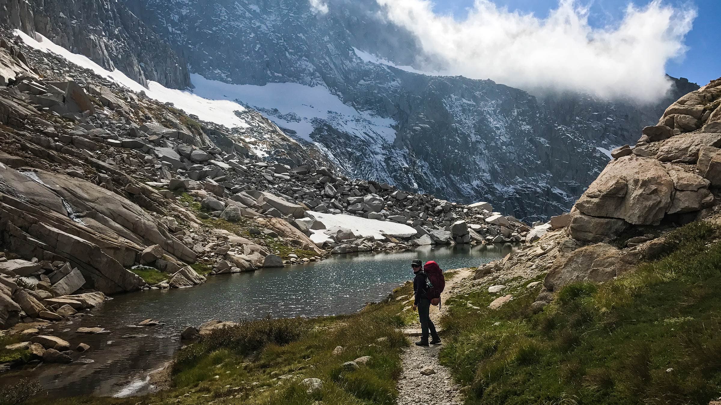 woman trail mountain lake