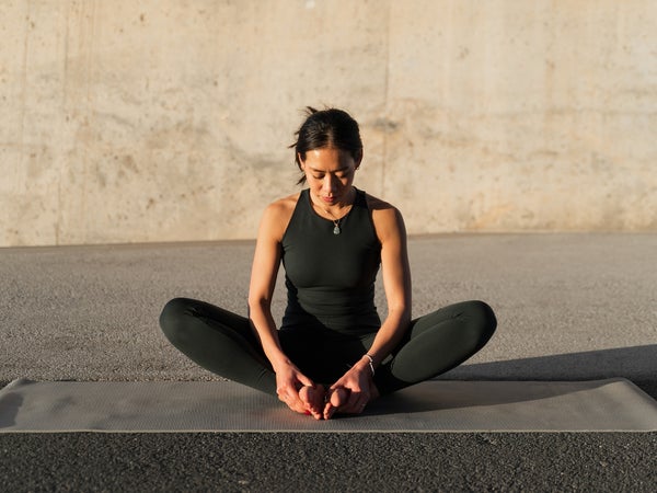 Woman Practices Butterfly Yoga Pose