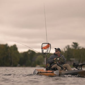 a man fishing from a boat