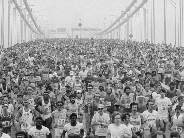 runners crossing a bridge at the New York City marathon