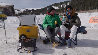 two skiers with drinks from Athletic Brewing Company