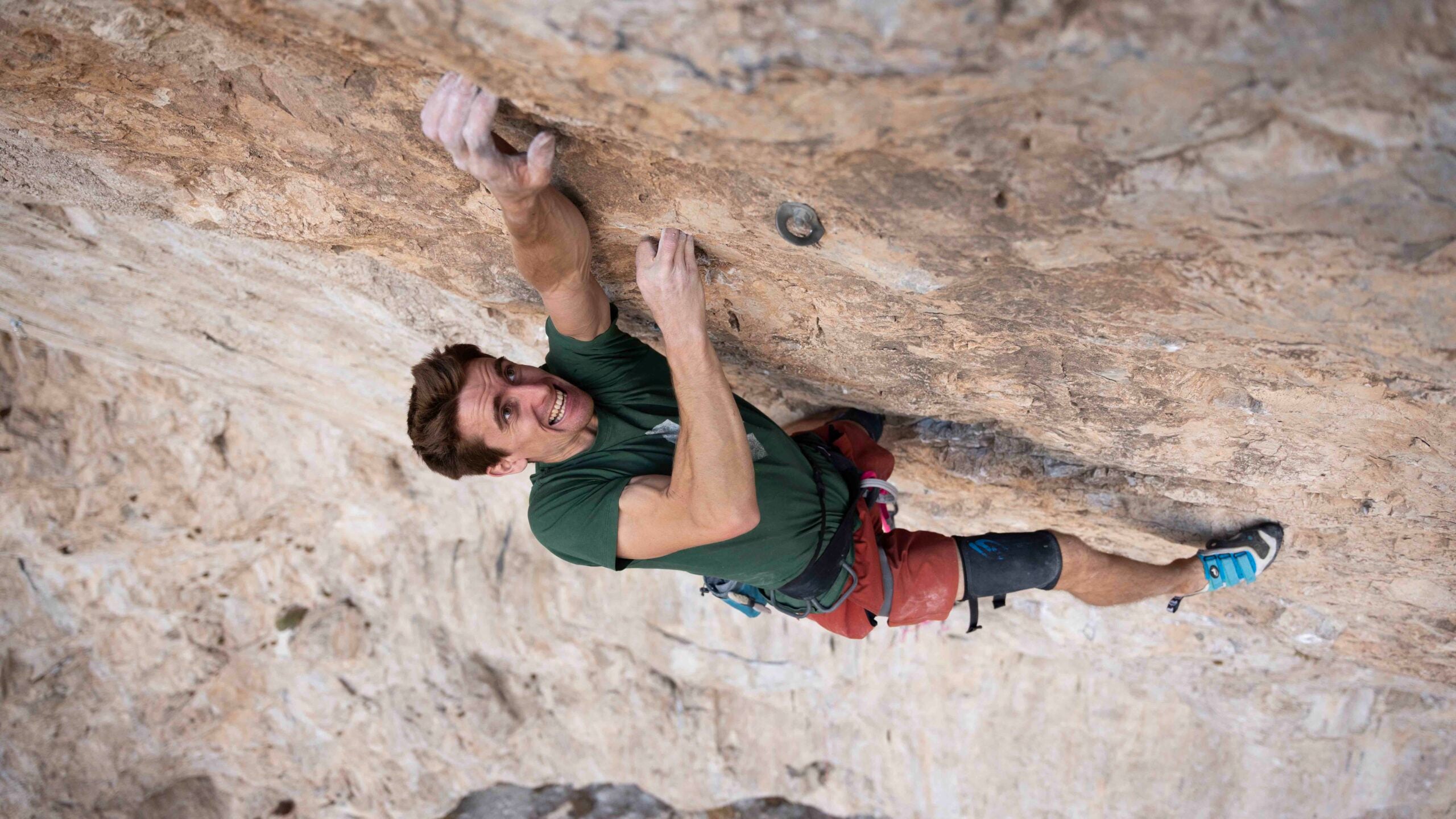 Seb Bouin hugs the rock in California.