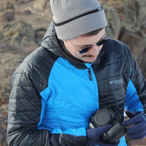 man with a camera in the winter