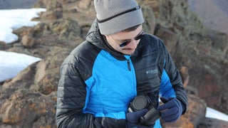 man with a camera in the winter