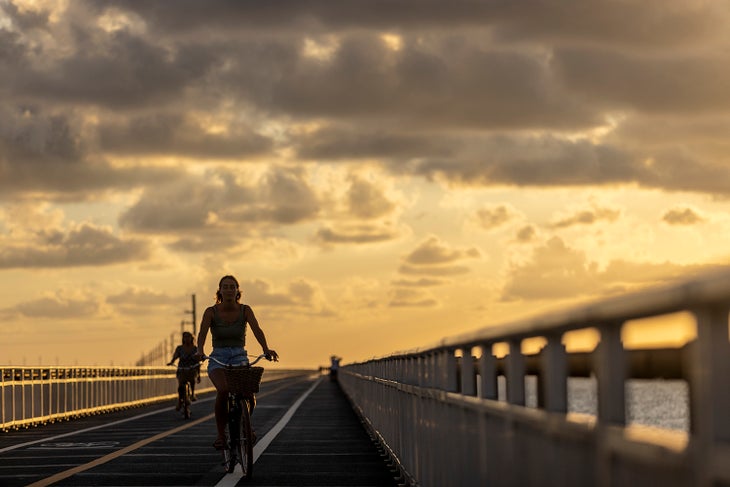 people biking on the seven mile bridge in the florida keys