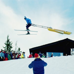Mac Smith wings it with a toboggan over the deck at the old ski patrol shack, now a restaurant, at Aspen Highlands. Smith is one of the many area legends, having served as director of the Highlands ski patrol for 42 years.