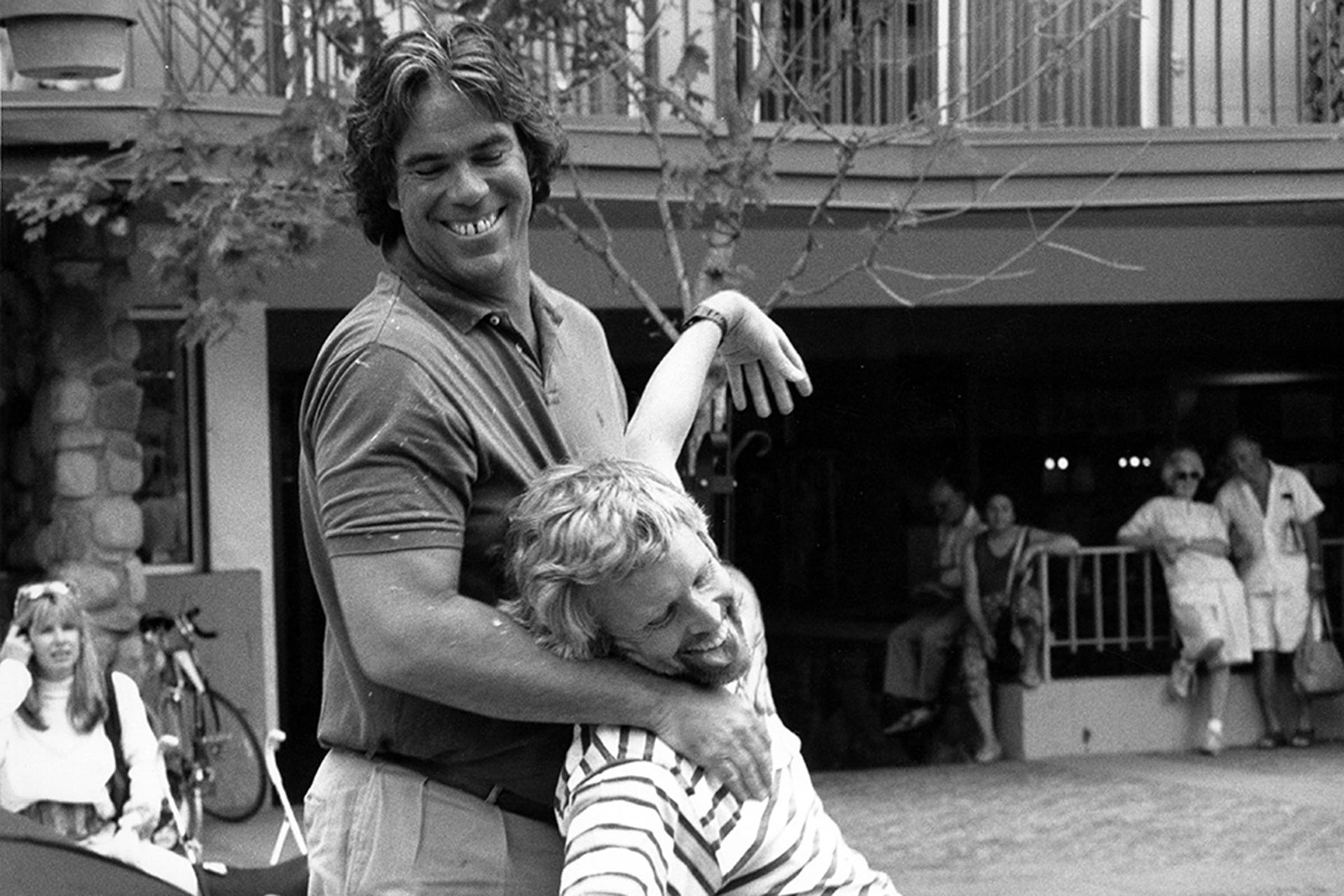 Sheriff Bob Braudis and former Aspen mayor, Stacey Standley, horsing around on the gondola plaza, 1990.