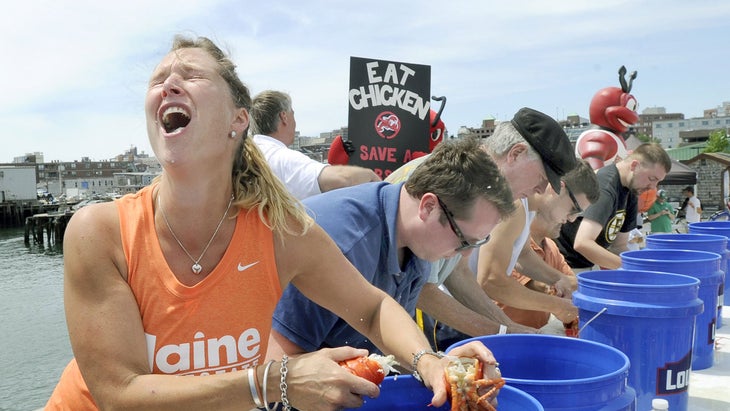 woman eating lobster