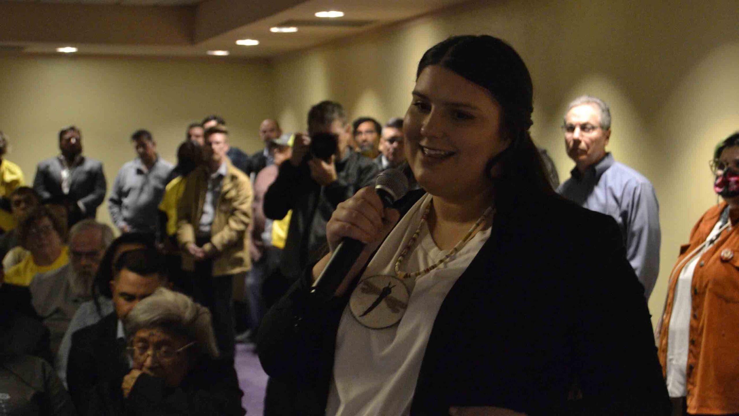 indigenous woman speaks at public hearing