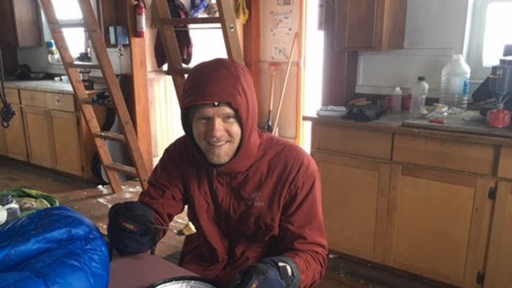 man in mountain hut