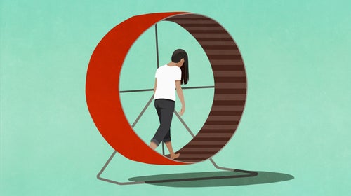 An illustration of a white woman with long brown hair looking dejected, walking on a large red hamster wheel against a turquoise background.