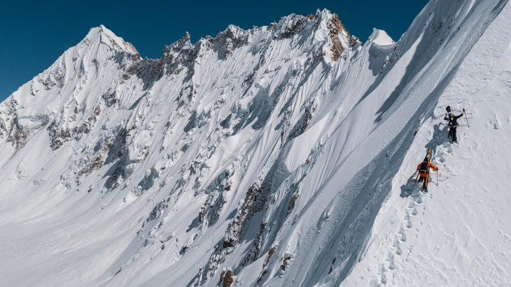 Skiers ascending a bootpack