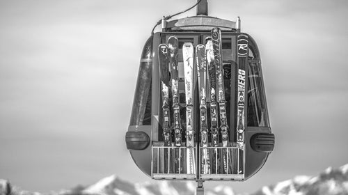 black and white image of a ski chairlift