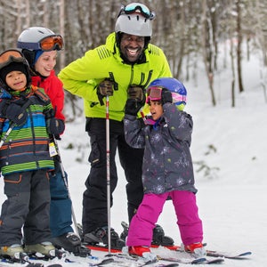 A family of four skiing