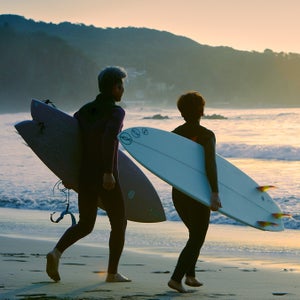 Couple surfing in Japan