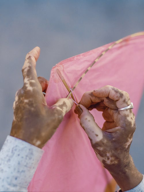 A kite made of paper, bamboo, and string