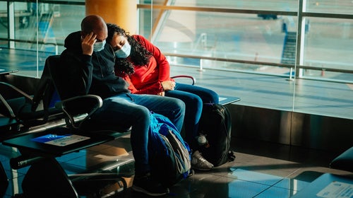 A tired couple at the airport in Buenos Aires, Argentina