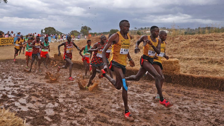 racing pack of runners in mud