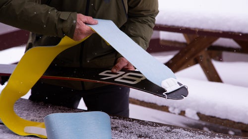 Attaching climbing skins to skis