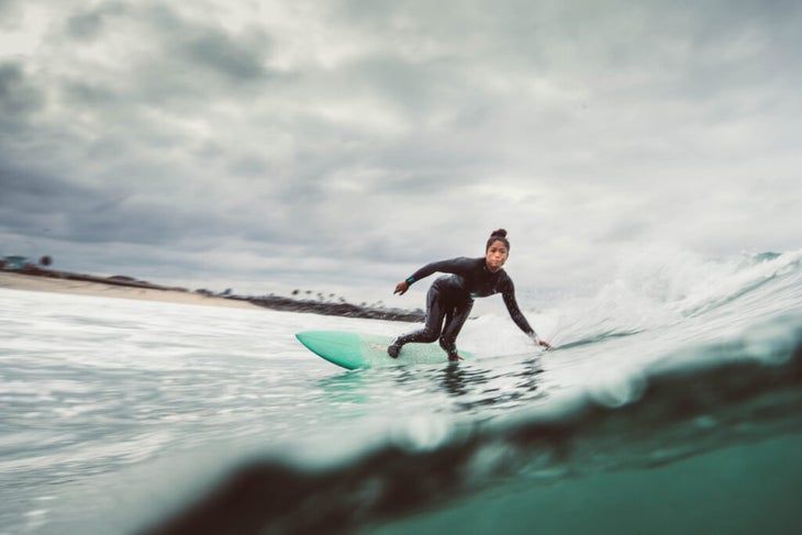 A woman surfboarding