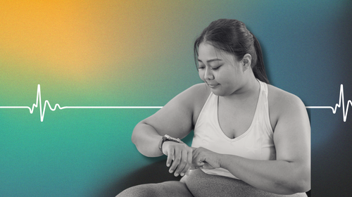 Young Woman Checking Her Fitness metrics data and Activity On A Smartwatch