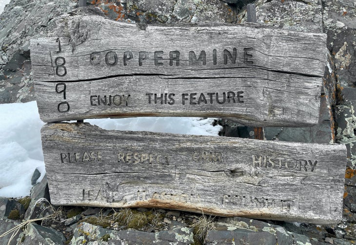 Coppermine sign that says "ENJOY THIS FEATURE"