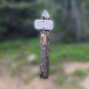 blank trail sign on blurry background