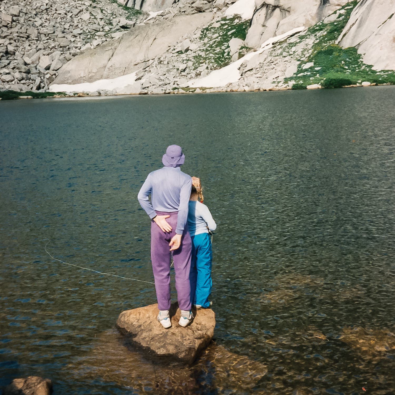 The author and her father fishing on a backpacking trip in the Winds