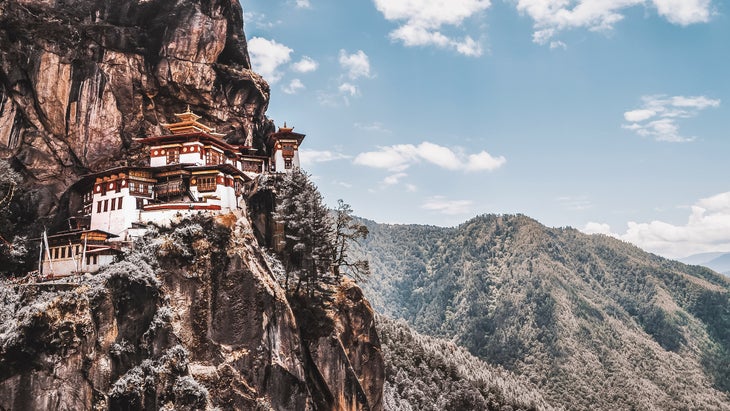 The 17th-century Paro Taktsang monastery, built into a Paro Valley cliff—a must-see on the Trans-Bhutan Trail