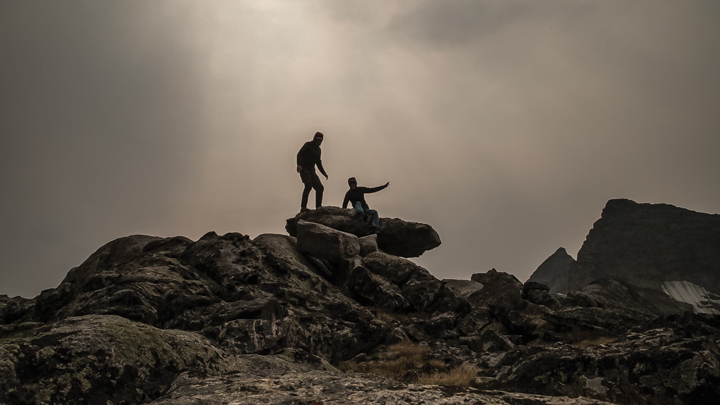 Friends of the author winding the Universe Clock in 2021