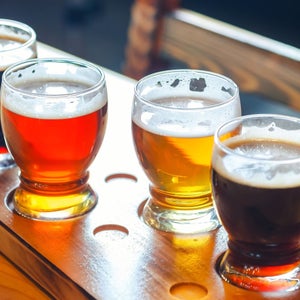 various beers lined up in a flight