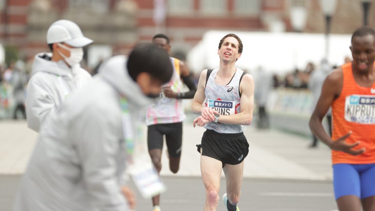 Cam Levins finishes a marathon with anguish on his face
