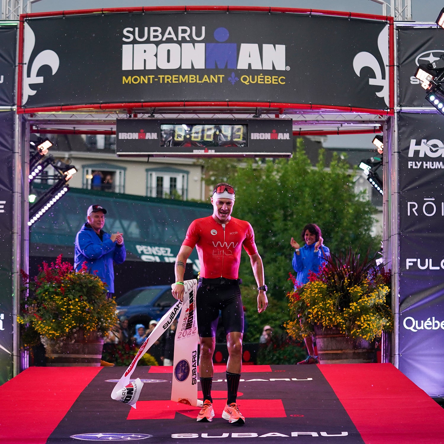 Collin Chartier of the United States celebrates after finishing in first place in the IRONMAN Mont-Tremblant on August 21, 2022