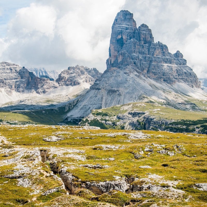 A mountainous environment with green meadows