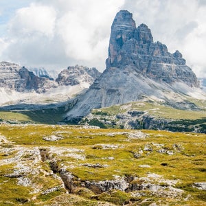A mountainous environment with green meadows