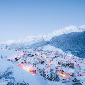 Traditional houses after snowfall during a winter sunset, Ardez, canton of Graubunden, Engadine, Switzerland