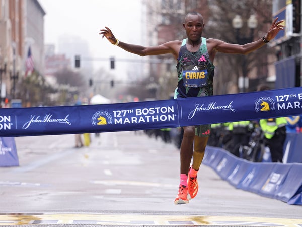 Evans Chebet of Kenya crosses the finish line in first place at the Boston Marathon