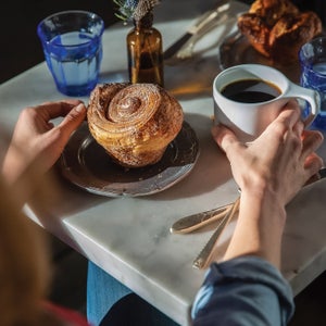 Persephone’s croissant-dough cinnamon roll pairs well with a hot cup of coffee.