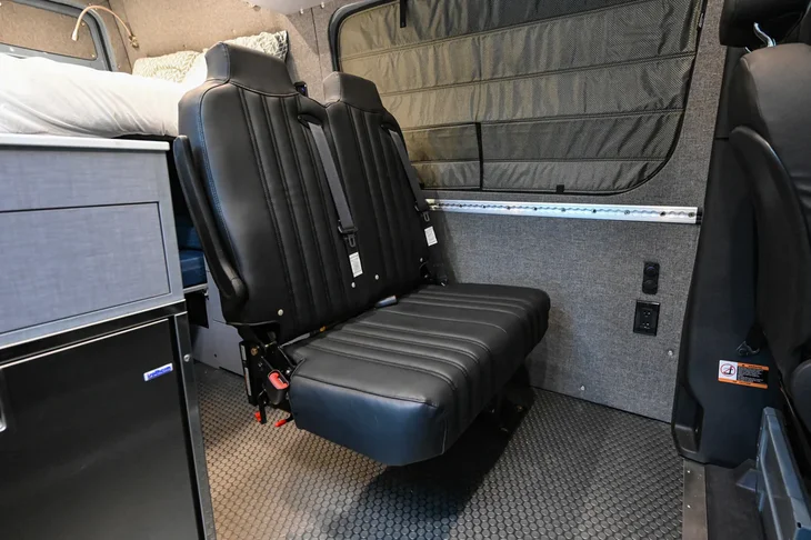 Hide N' Go folding seat in Sprinter Van