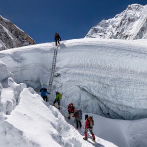 Climbers navigate a glacier on Mount Everest