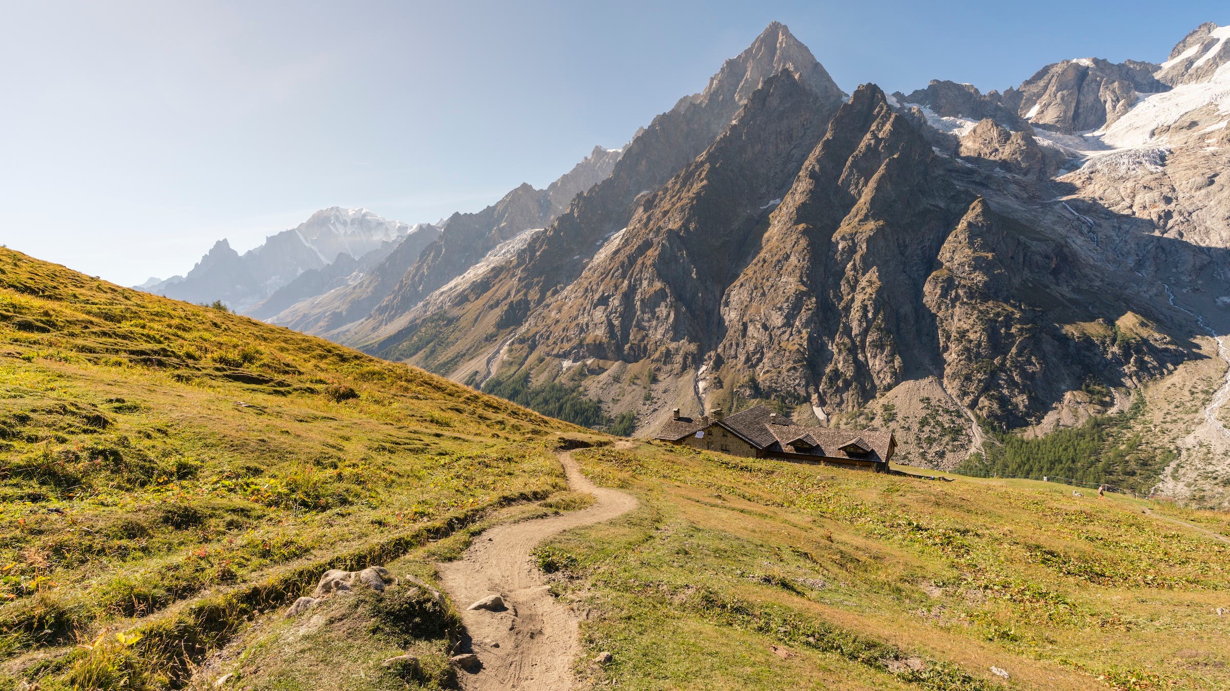 A mountain trail in Italy with hazy blue sky