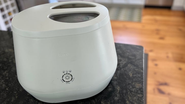 Lomi Home composter on black countertop
