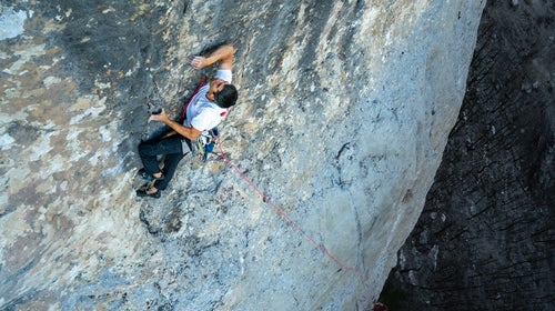 Climber with hardware attached to a harness