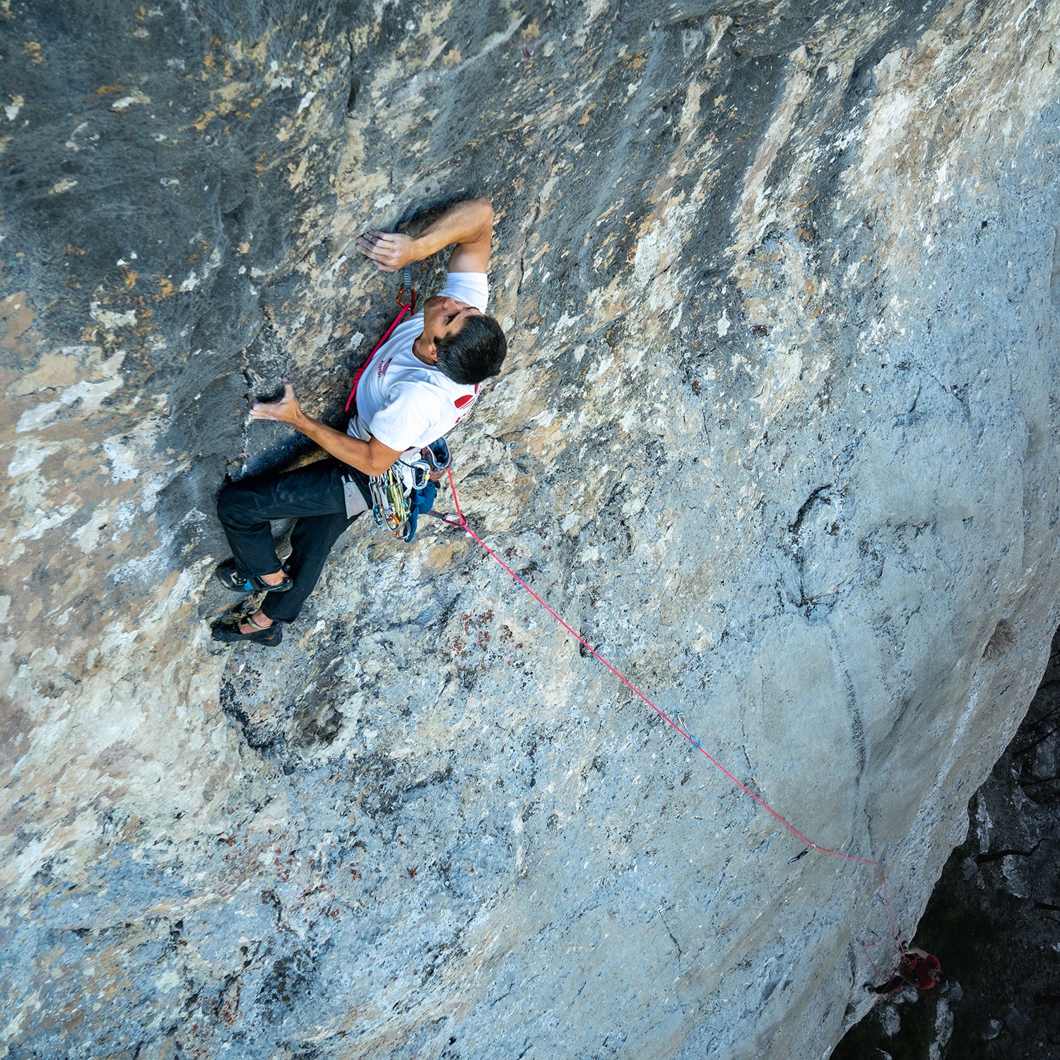 Climber with hardware attached to a harness