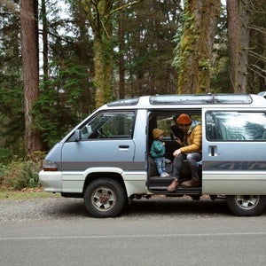 Father and daughter in a retro van