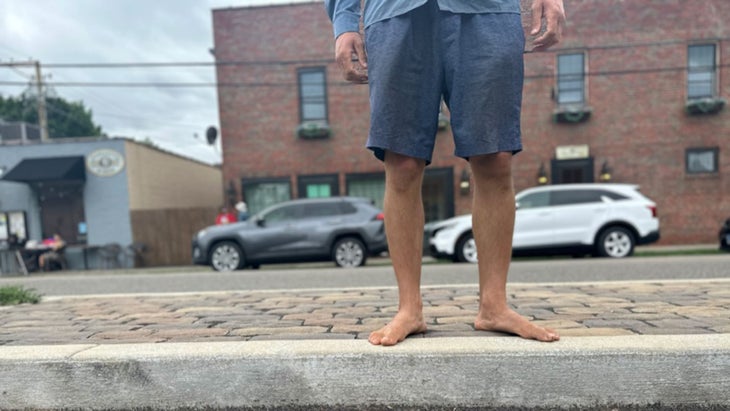 thru-hiker walking barefoot
