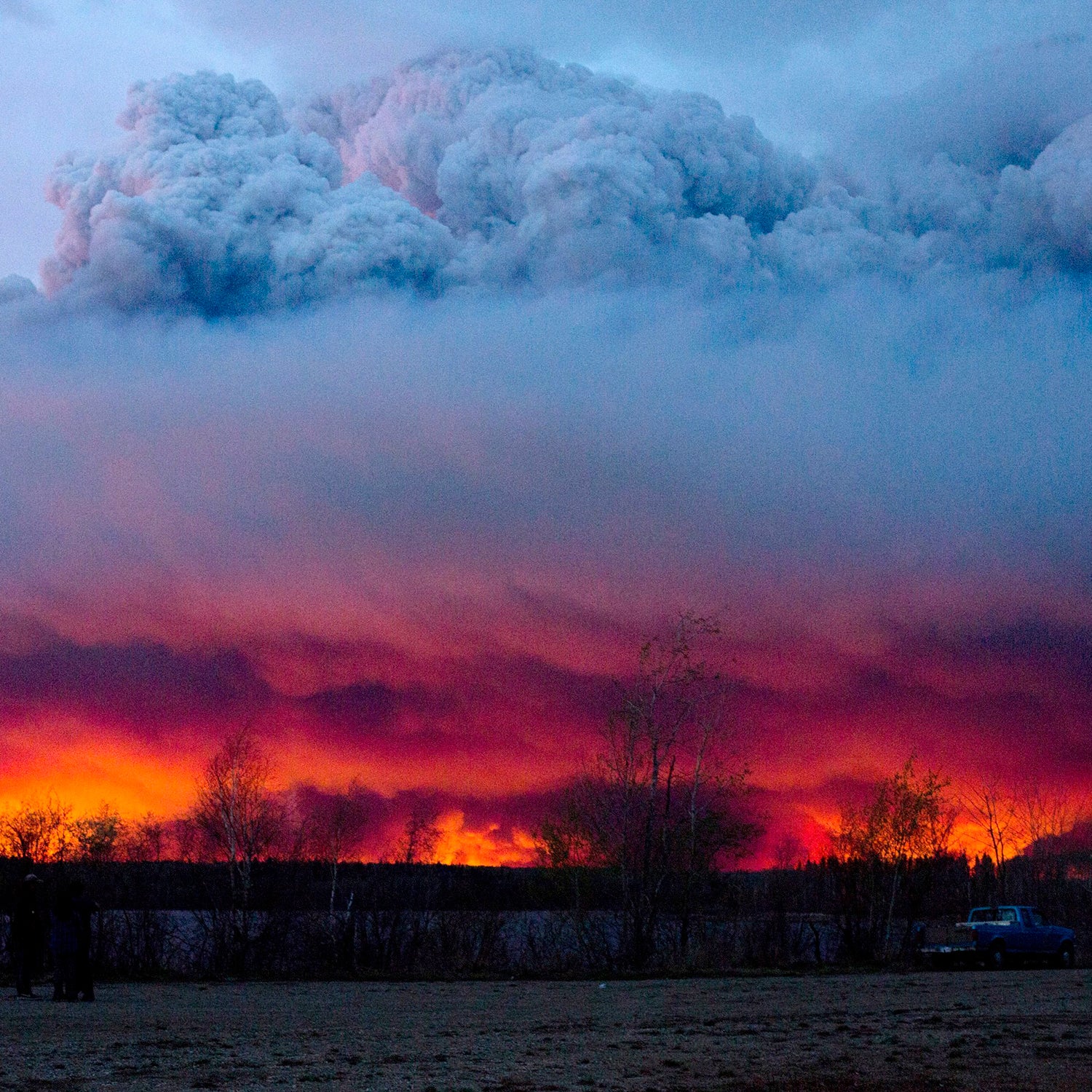 A wildfire moves towards the town of Anzac from Fort McMurray, Alberta., on May 4, 2016.